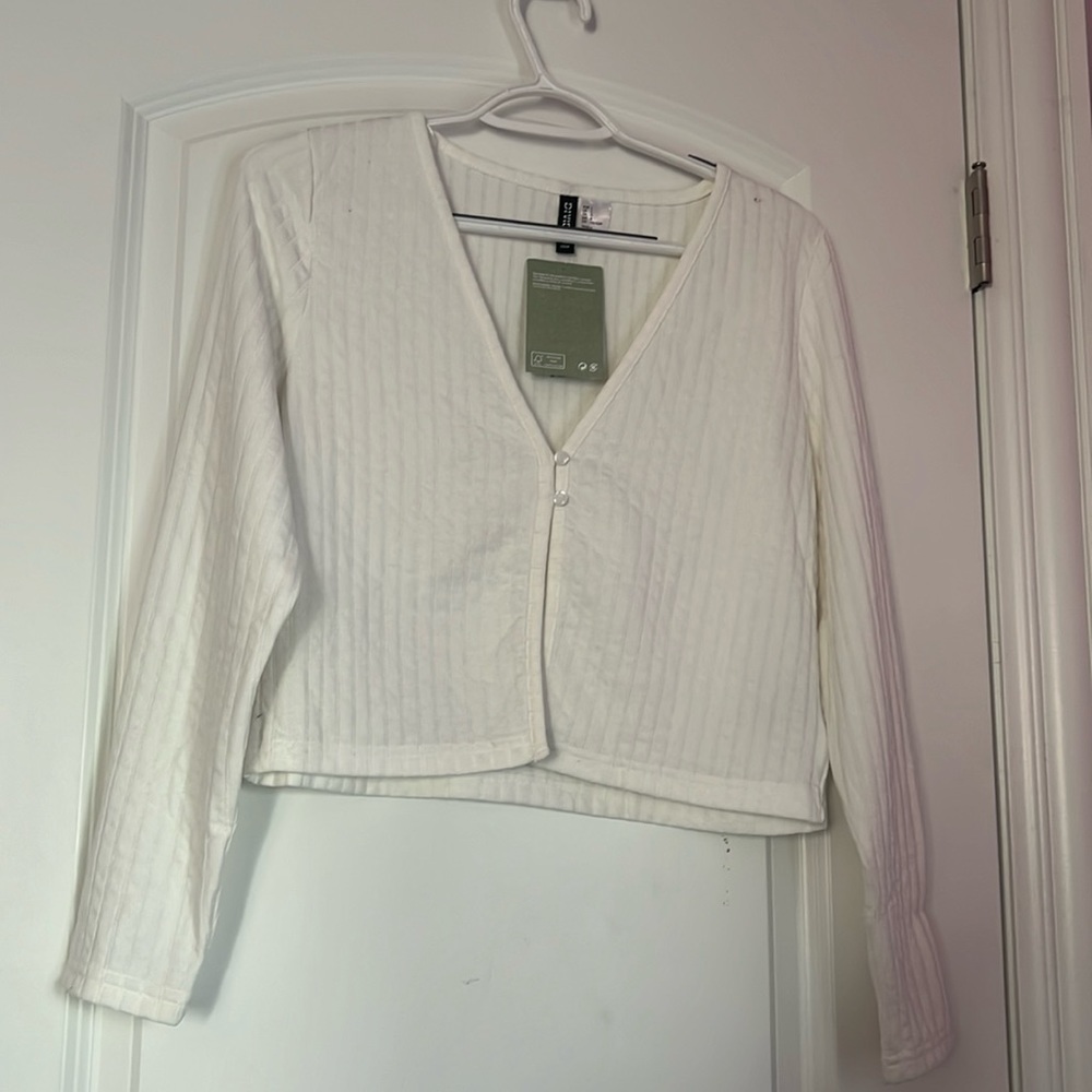 White cardigan. NEVER worn. Very soft and stretchy.